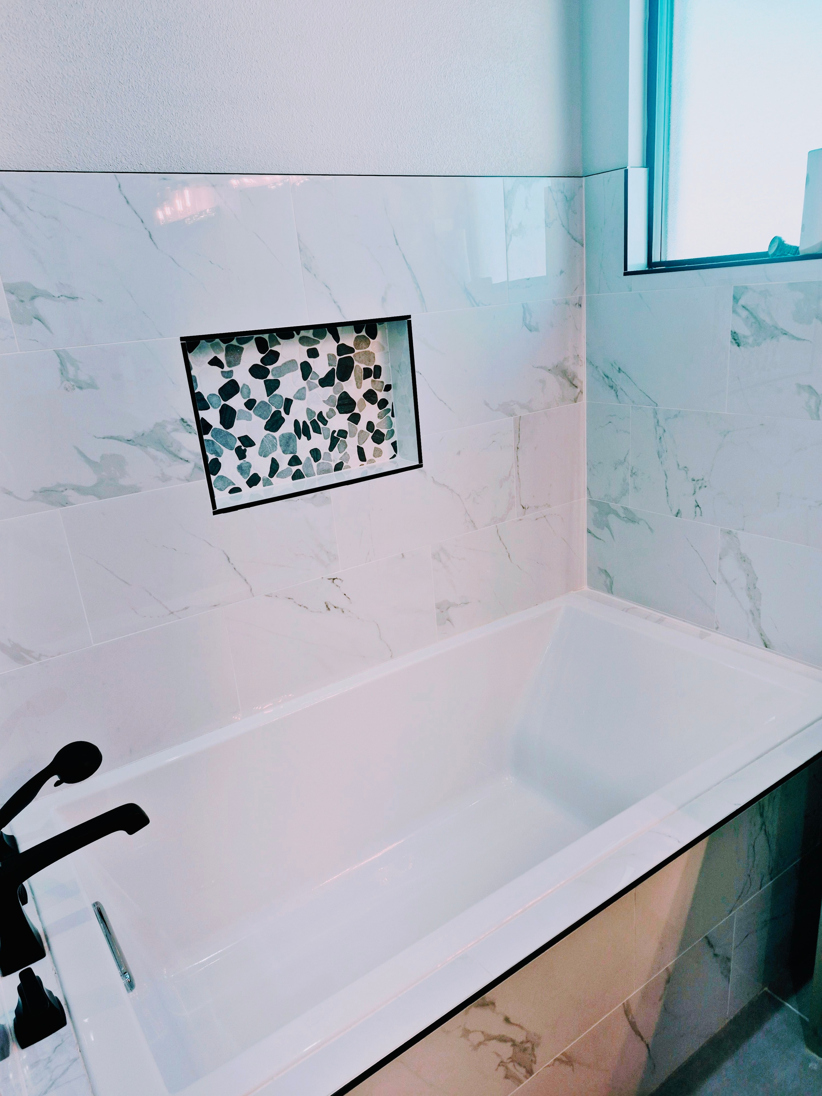 Marble Tub Surround cleaned by Redeemed Cleaning Services in Midland TX